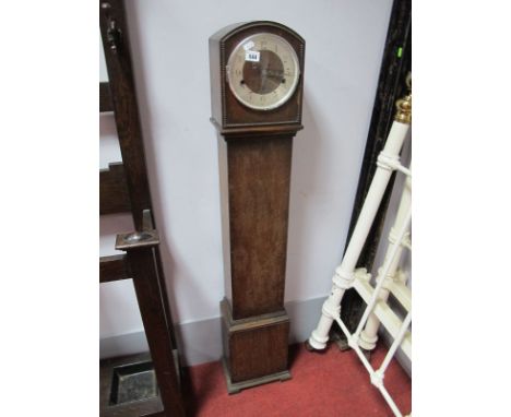 A Circa 1930's Oak Granddaughter Clock, silvered chapter ring, Arabic numerals, beading to the arched top. 