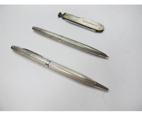 A Hallmarked Silver Engine Turned Pen, together with similar pencil and a smokers knife with hallmarked silver scales. (3)