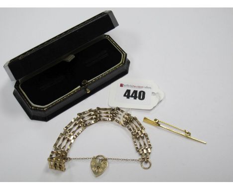 A Novelty 9ct Gold Oar Brooch, together with a 9ct gold gate link style bracelet. (2)
