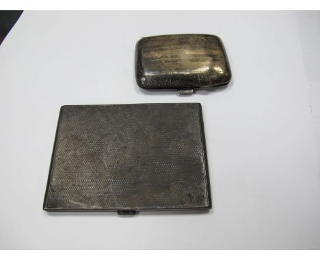 A Hallmarked Silver Slim Cigarette Case, allover engine turned, together with another cigarette case. (2) 