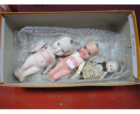 Three Early XX Century Bisque Kewpie Dolls, with moving arms, 11 - 16cms.