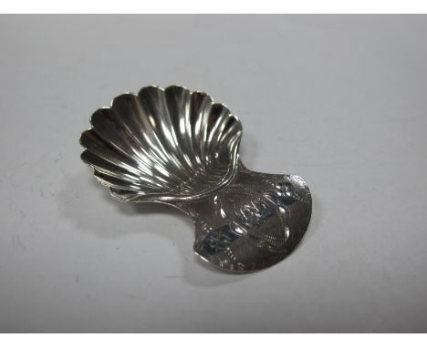 A XIX Century Caddy Spoon, with shell bowl, the curved handle initialled.