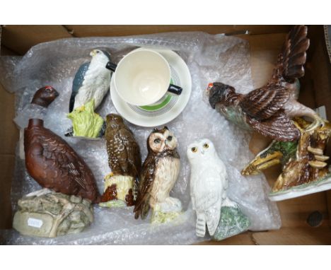 A collection of Royal Doulton Birds to include:  The Famous Grouse Decanter, Short Eared Owl, Snowy Owl, Buzzard, Merlin toge