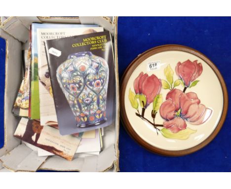 Moorcroft wall plaque decorated in Magnolia in wood frame and a collection of Moorcroft collectors club colour magazines.