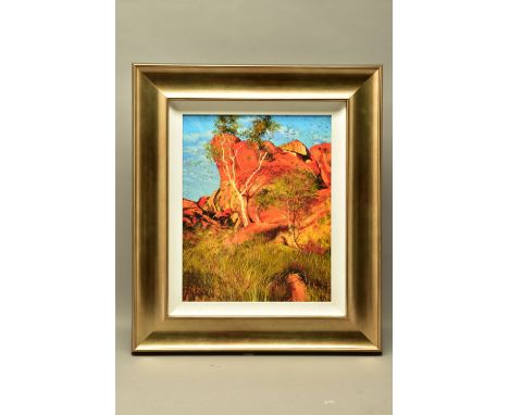 ROLF HARRIS (AUSTRALIAN 1930) 'SUN ON DEVIL'S MARBLES', a limited edition print of an Australian landscape 124/195, signed bo