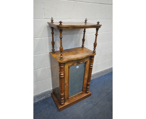 A VICTORIAN WALNUT SERPENTINE MUSIC CABINET, the raised top supported by turned uprights, over a base with a mirror plate, wi