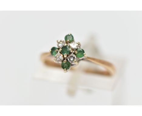 A 9CT GOLD EMERALD AND DIAMOND CLUSTER RING, diamond shape cluster set with four circular cut emeralds and four single cut di