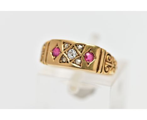 A LATE VICTORIAN 18CT GOLD, RUBY AND DIAMOND RING, the centre of the ring is set with a single four claw set, old cut diamond