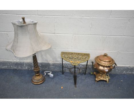 A COPPER AND BRASS SAMOVAR, along with a brass trivet and a table lamp with a fabric shade (crack to centre of table lamp) (3