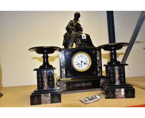 A BLACK SLATE AND MARBLE CLOCK GARNITURE, the rectangular clock case surmounted by a seated female figure with a shield, the 