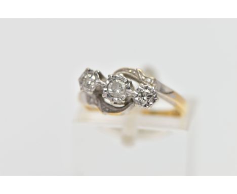 A YELLOW METAL THREE STONE DIAMOND RING, designed with three graduated, round brilliant cut diamonds, each illusion set in a 