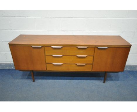 A MID-CENTURY AUSTINSUITE TEAK SIDEBOARD, with double cupboard doors flanking three drawers, unsigned, width 184cm x depth 49