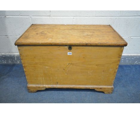 A 19TH CENTURY PINE BLANKET CHEST, enclosing an internal candle box, with twin handles, on bracket feet, width 84cm x depth 4