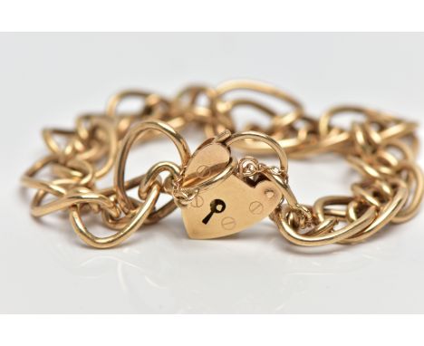 A 9CT GOLD BRACELET, yellow gold multi oval hollow link bracelet, hallmarked 9ct Birmingham, fitted with a heart padlock clas