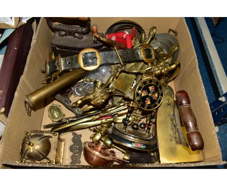 ONE BOX OF BRASSWARE, to include horse leathers, one brass iron, one cast iron, a long handled ladle, two clocks, several pie