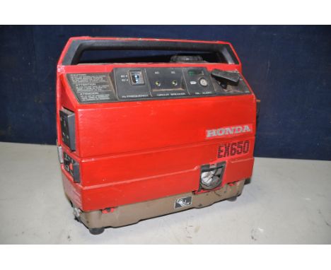 A HONDA EX650 SILENT GENERATOR (UNTESTED but engine pulling freely) a Braun paximat multimag projector, and a reflecta diamet