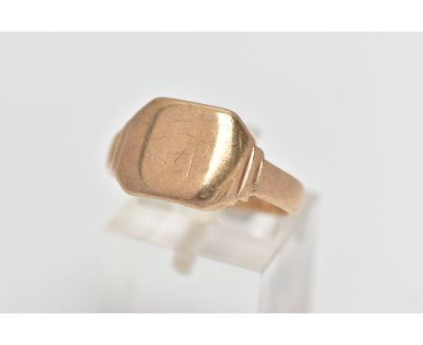 A YELLOW METAL SIGNET RING, of a square form, worn engraved initials, polished band, stamped 9ct, ring size R slightly bent s