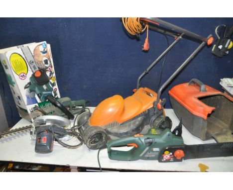 A FLYMO EASIMO LAWN MOWER, along with a Black and Decker GK1635T electric chainsaw, Black and Decker GT200 hedge trimmer, and