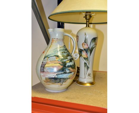 A MICHAEL &amp; BARBARA HAWKINS PORT ISAAC POTTERY LAMP AND JUG, hand thrown pottery painted in a water colour effect, the la