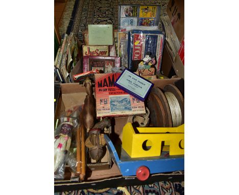 TWO BOXES OF VINTAGE WOODEN AND CARD JIGSAW PUZZLES, CELLULOID TOYS AND A 1960S SOCCERETTE FOOTBALL GAME, to include a collec