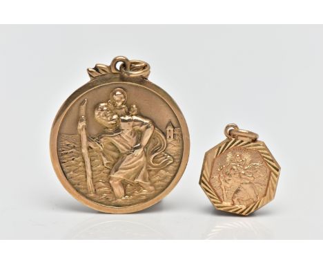 TWO 9CT GOLD ST.CHRISTOPHER PENDANTS, the first a of a circular form, personal engraving to the reverse partially worn name, 