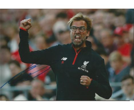 Jurgen Klopp Signed Liverpool football 8x12 Photo . Good condition.  All signed items come with our certificate of authentici