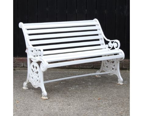 An early 20th century painted cast iron garden bench, of thistle and rose design, 131cm, together with a wrought iron based g