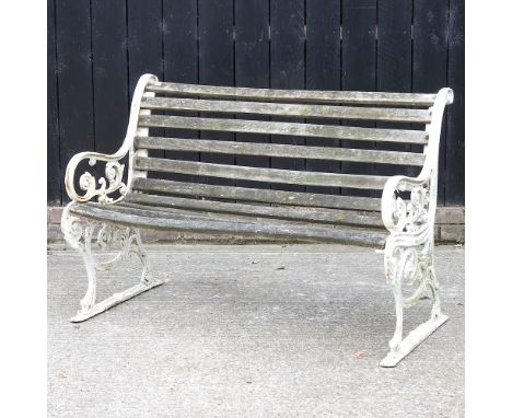 A Victorian style garden bench, with dolphin supports, 118cm