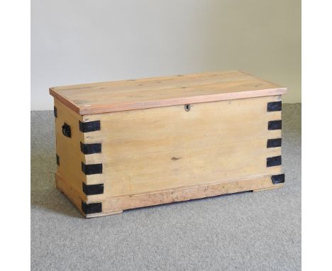 An antique pine and metal bound trunk, 90cm