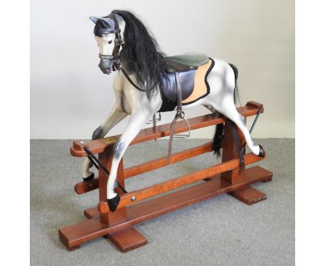 A Haddon painted wooden dappled grey rocking horse, 110cm high overall