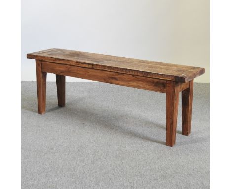 A rustic pine bench, on square legs, 134cm