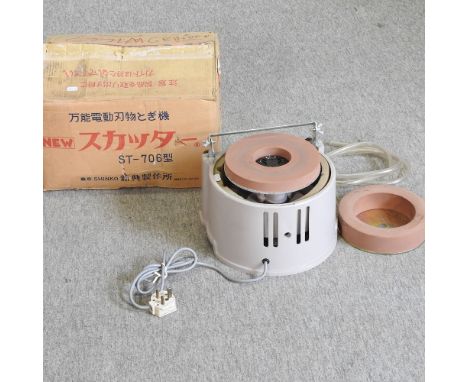 An electric fine sanding / sharpening tool