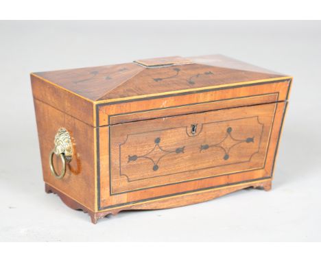 A Regency mahogany tea caddy of sarcophagus form, the hinged lid and sides with ebony inlaid decoration, width 32cm.Buyer’s P
