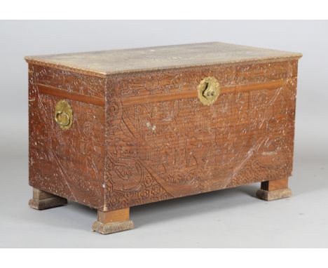 A Chinese carved wooden trunk, profusely carved with figures and landscapes, height 61cm, width 102cm, depth 52cm.Buyer’s Pre