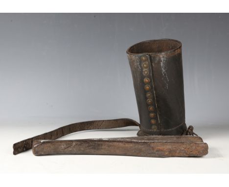 An 18th/19th century Continental leather wine bottle holster with curved base and applied belt, length 22cm, together with wo