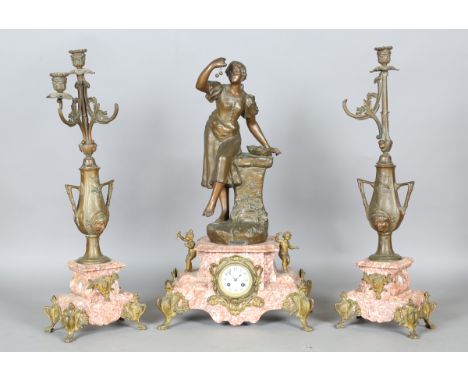 A French Art Nouveau patinated spelter and pink veined marble figural clock garniture, the central figure titled 'Les Cerises