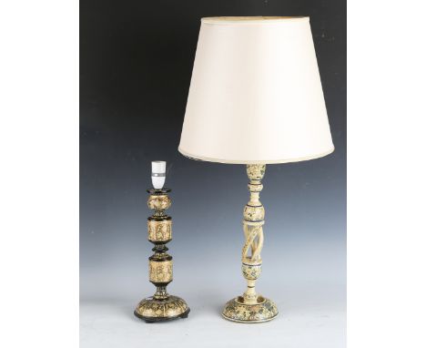 A Kashmiri table lamp with open spiral stem, height 40cm, and another similar table lamp, height 32cm.Buyer’s Premium 29.4% (
