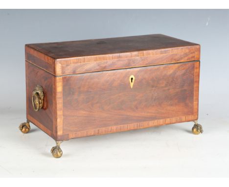 A George IV mahogany tea caddy with tulipwood crossbanding and gilt brass claw and ball feet, width 31cm.Buyer’s Premium 29.4