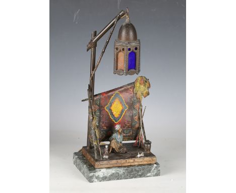 After Franz Xavier Bergman - a 20th century painted spelter figural table lamp, modelled in the form of an Arabian carpet sel