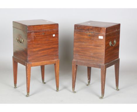 A pair of George III style mahogany wine coolers, each fitted with two brass swing handles, on square tapering legs terminati