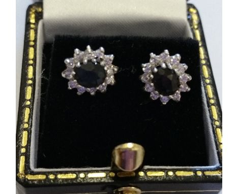 A Pair Of Gold Diamond And Sapphire Cluster Earrings.