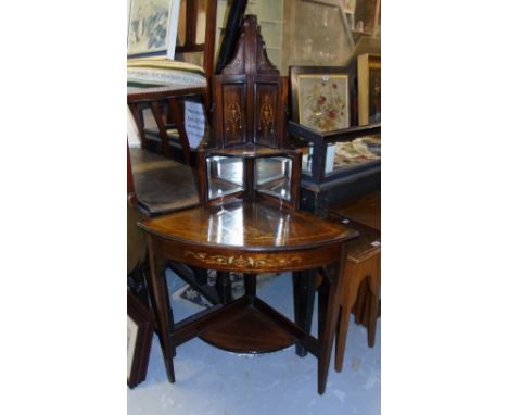 An Edwardian Rosewood Corner Table; with line, urn and bellflower inlay with mirrored corner shelf over, and raised on three 