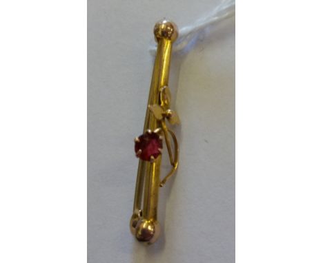 An Antique Gold Ruby Set Bar Broach.