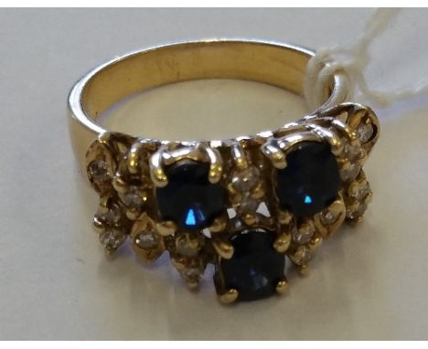 A 14ct Diamond Sapphire Ring, sapphire 1 carat, diamonds 1/2 carat.