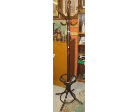 A Bentwood Coat Stand and an Oval Chinese Rug.