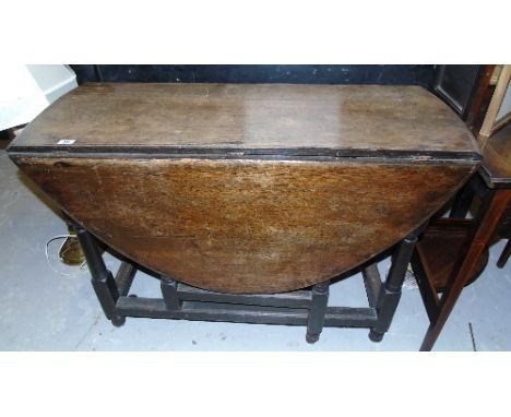A Late 19th Early 20th Century Oak Gate Leg Table.