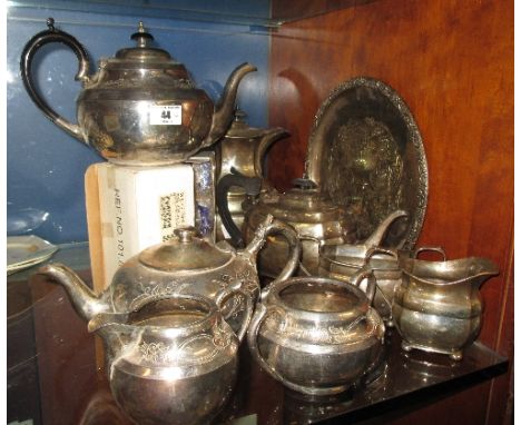 A Shelf of Silver-Plate & Pair of Victorian Brass Candlesticks.