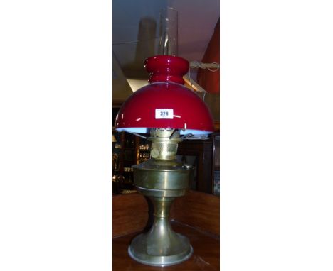 An Early 20th Century Paraffin Lamp with Ruby Shade & Chimney.