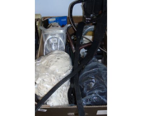 A Box To Include A Show Helmet, String Sweat Sheet, Stirrups, Side Reins, Stirrup Grips, Two Head Bands and Others.