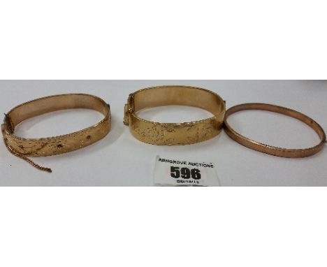 A 9ct Gold & Engraved Bangle, together with Two Rolled Gold Examples (3).